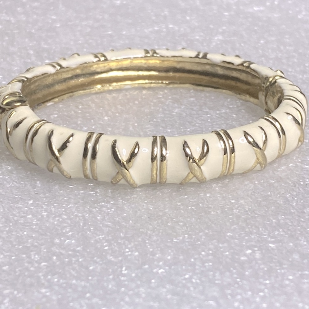 Cream and gold colored bracelet ridged bracelet